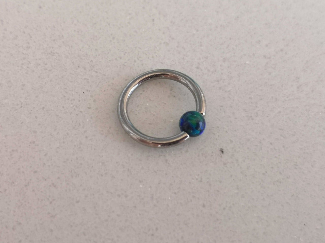 Small Captive Bead Ring with a Dark Blue Opal Ball