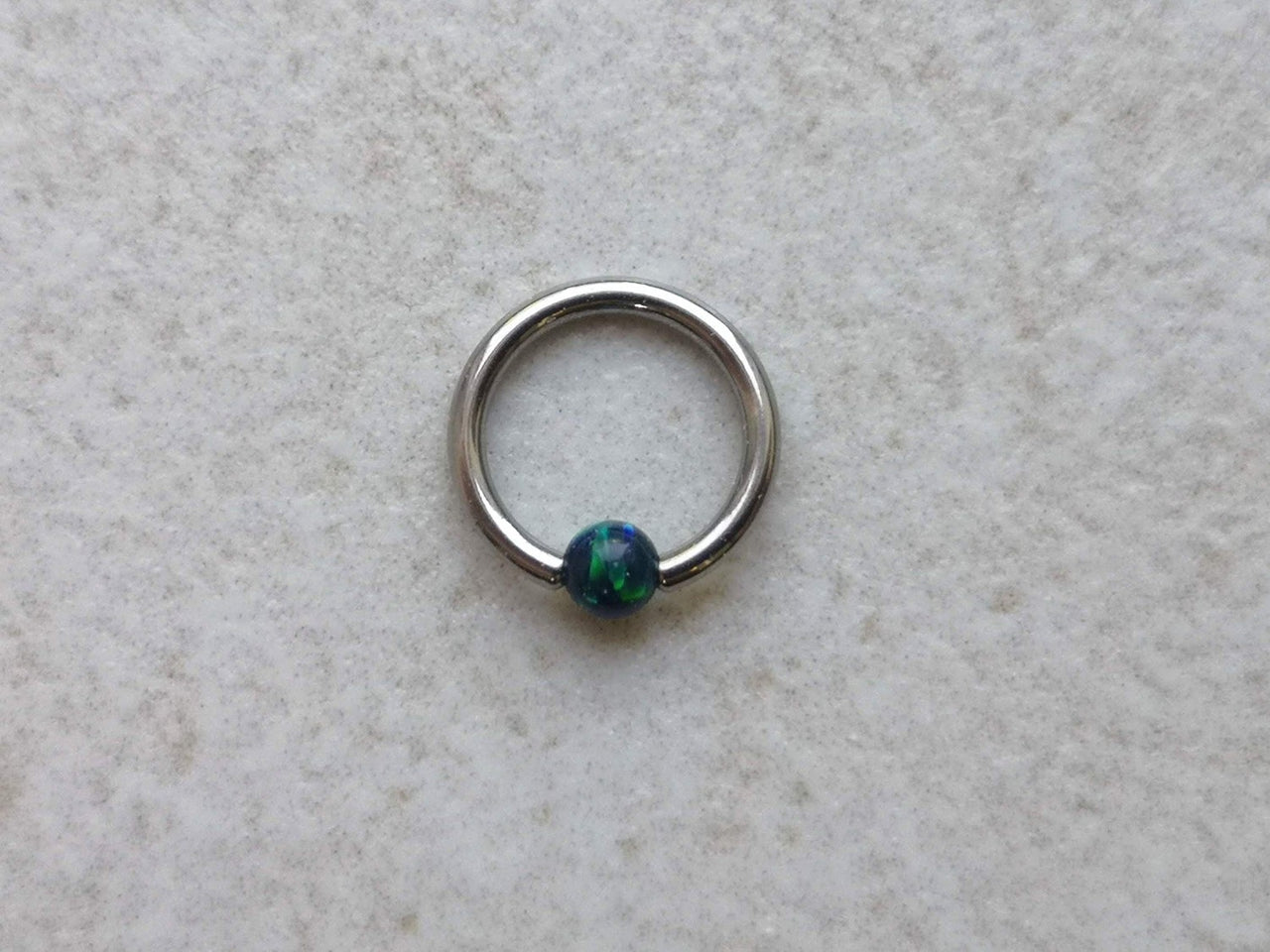 Small Captive Bead Ring with a Dark Blue Opal Ball