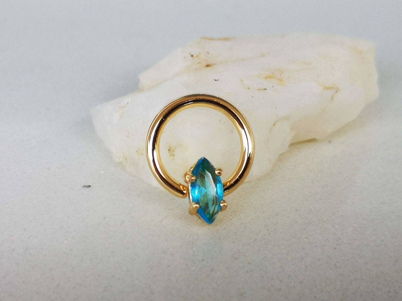 Summer Design Gold Captive Bead Ring with Blue Crystal