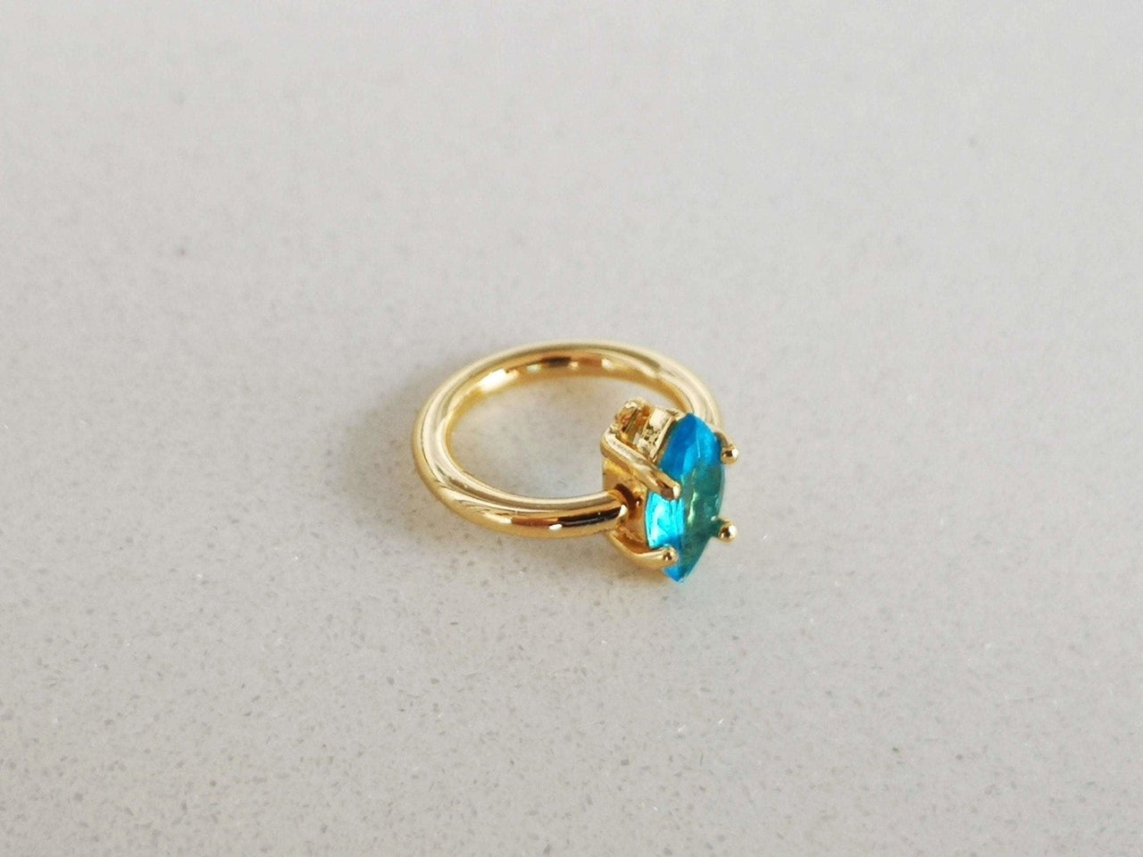 Summer Design Gold Captive Bead Ring with Blue Crystal