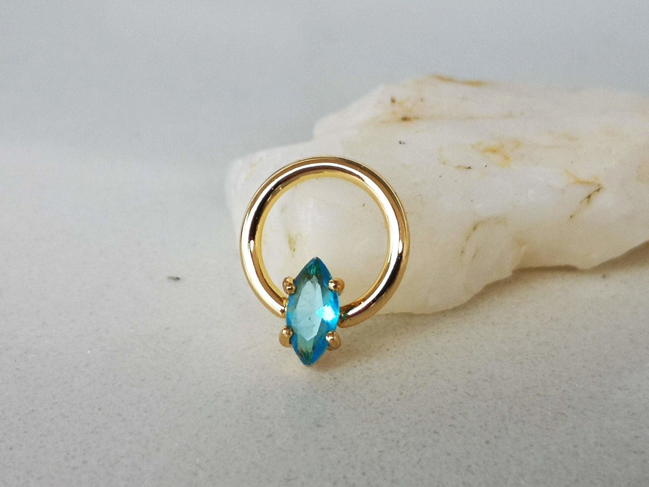 Summer Design Gold Captive Bead Ring with Blue Crystal