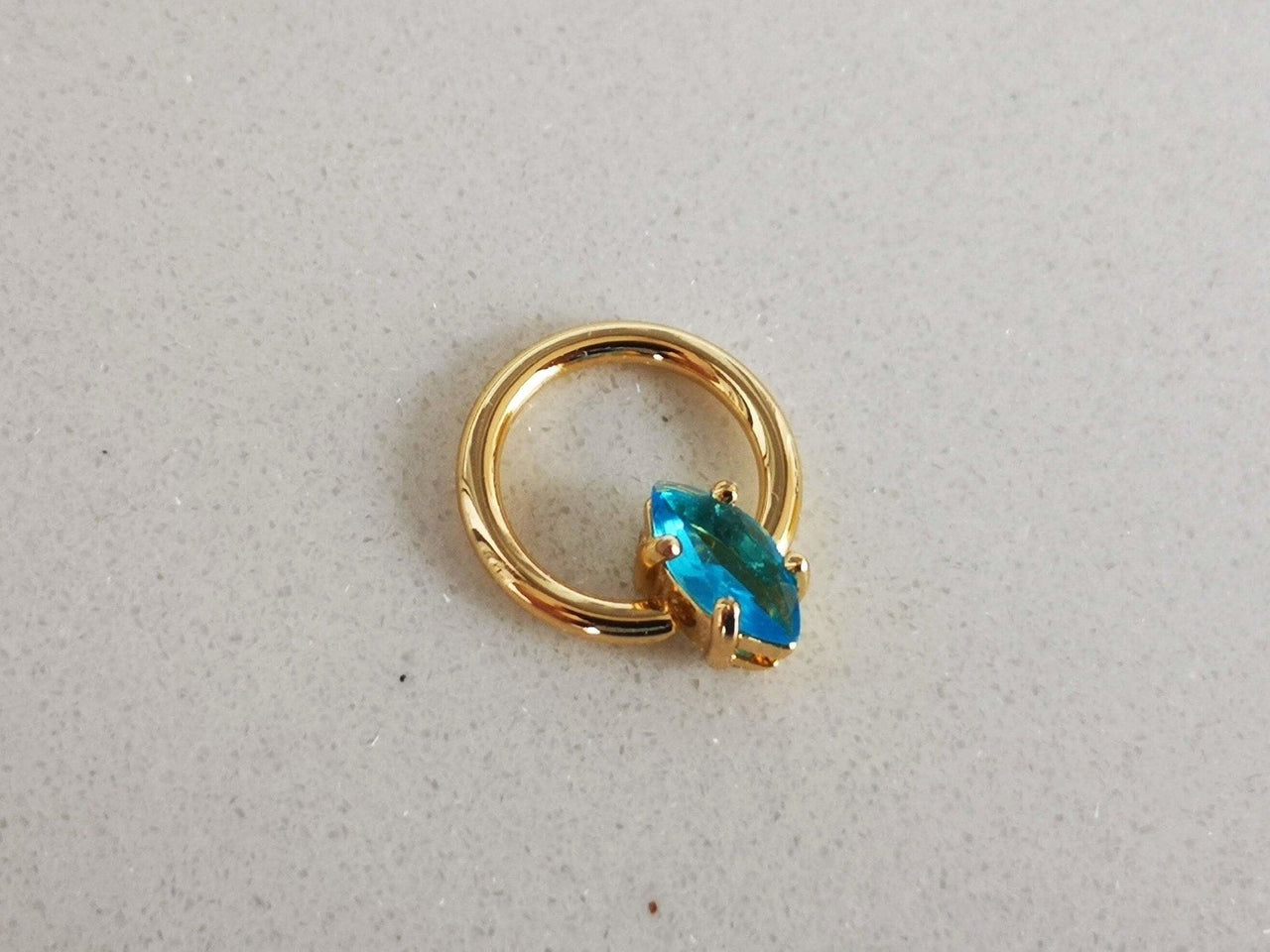 Summer Design Gold Captive Bead Ring with Blue Crystal